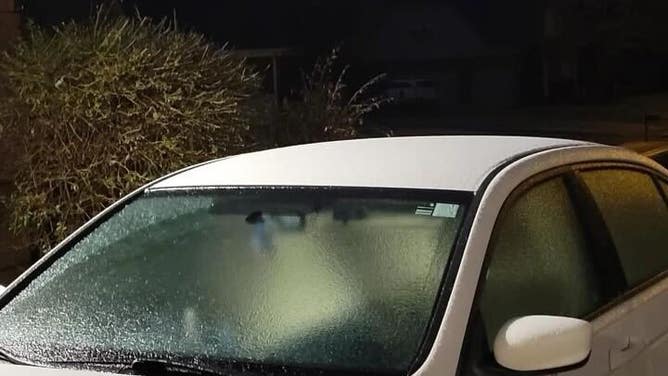 Ice is seen coating a car in Collierville, Tennessee.