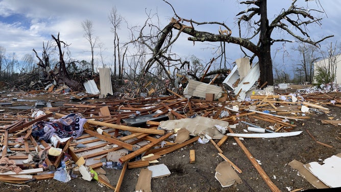A crushed tree surrounded by debris next to Wadsworth Baptist Church in Deatsville, Alabama.  A tornado hit the building on January 12, 2023.