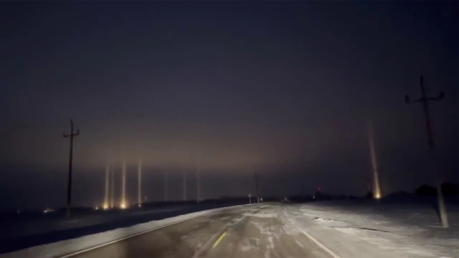 Ice crystals in the clouds over Graceville, Minnesota, sent vertical beams of light high into the sky early Friday morning, showcasing a phenomenon known as light pillars.