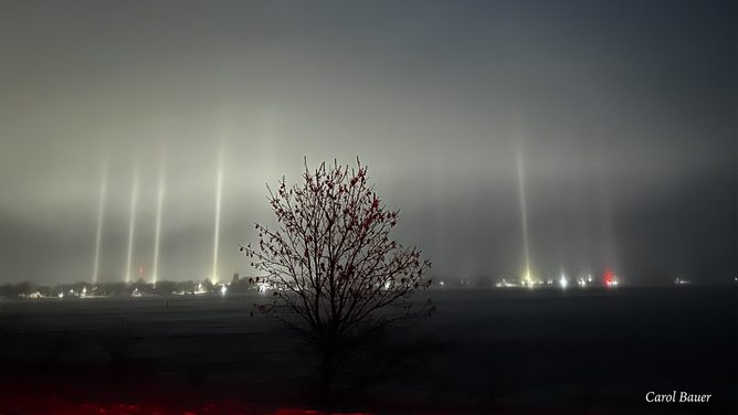 Ice crystals in the clouds over Graceville, Minnesota, sent vertical beams of light high into the sky early Friday morning, showcasing a phenomenon known as light pillars.