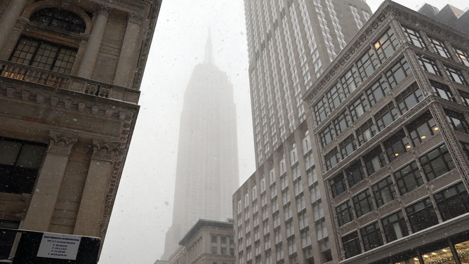 FILE - Snow enshrouds the Empire State Building during a snowstorm on January 29, 2022 in New York City.