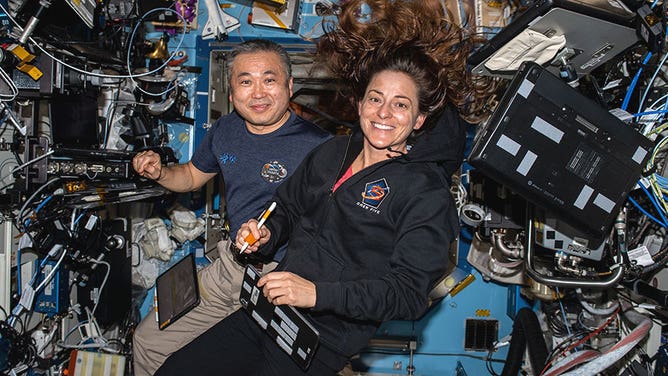 Astronauts Koichi Wakata, of JAXA, and Nicole Mann, of NASA, are pictured inside the International Space Station’s Destiny laboratory module.