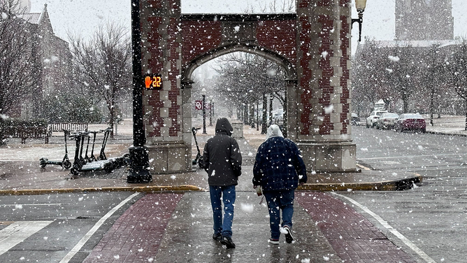 Snow is seen falling across Norman, Oklahoma, on Jan. 24, 2023.