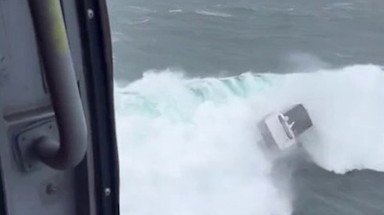 Watch the heroic rescue after boat capsizes from treacherous waves