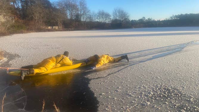 First responders work to rescue a dog from a frozen pond on Wareham, Massachusetts during a polar vortex. Temperatures in Wareham were as low as -7ºF on the day of the rescue.
