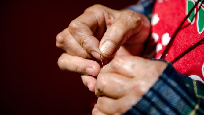 Close-up of hands.