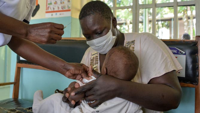 A child gets a malaria vaccination at Yala Sub-County hospital, in Yala, Kenya, on October 7, 2021.