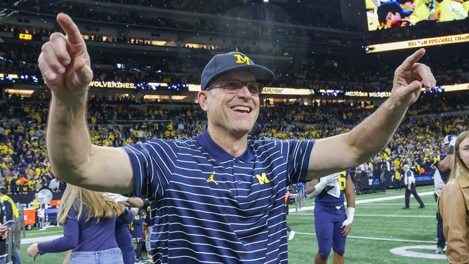 Jim Harbaugh celebrates following the Big Ten Championship at Lucas Oil Stadium on December 4, 2022 in Indianapolis, Indiana. 