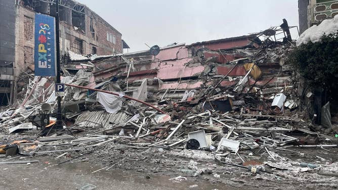 MALATYA, TURKIYE - FEBRUARY 06: A view of debris of collapsed building after 7.7 magnitude earthquake hits Malatya, Turkiye on February 06, 2023. Disaster and Emergency Management Authority (AFAD) of Turkiye said the 7.7 magnitude quake struck at 4.17 a.m. (0117GMT) and was centered in the Pazarcik district in Turkiyeâs southern province of Kahramanmaras. Gaziantep, Sanliurfa, Diyarbakir, Adana, Adiyaman, Malatya, Osmaniye, Hatay, and Kilis provinces are heavily affected by the quake. (Photo by Volkan Kasik/Anadolu Agency via Getty Images)