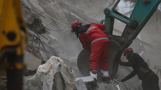 OSMANIYE, TURKIYE - FEBRUARY 06: Search and rescue operations continue at collapsed building after 7.7 and 7.6 magnitude earthquakes hits Osmaniye, Turkiye on February 06, 2023. Disaster and Emergency Management Authority (AFAD) of Turkiye said the 7.7 magnitude quake struck at 4.17 a.m. (0117GMT) and was centered in the Pazarcik district and 7.6 magnitude quake struck in Elbistan district in the province of Kahramanmaras in the south of Turkiye. Gaziantep, Sanliurfa, Diyarbakir, Adana, Adiyaman, Malatya, Osmaniye, Hatay, and Kilis provinces are heavily affected by the earthquakes. (Photo by Ozan Efeoglu/Anadolu Agency via Getty Images)