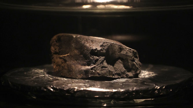 The Winchcombe meteorite sits on display at the Natural History Museum on May 13, 2021 in London, England. 