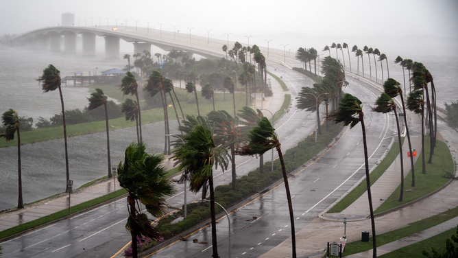 FILE - Wind gusts blow across Sarasota Bay as Hurricane Ian churns to the south on September 28, 2022.