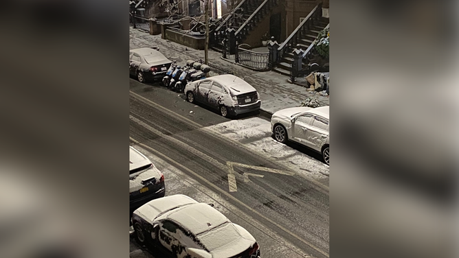 Snow covering roads and cars in Brooklyn, New York.