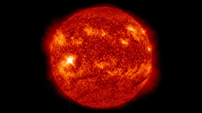 NASA’s Solar Dynamics Observatory captured this image of a solar flare – as seen in the bright flash in the center-left– on Feb. 11, 2023.