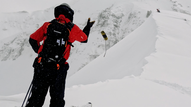 An explosive is thrown into the snow.