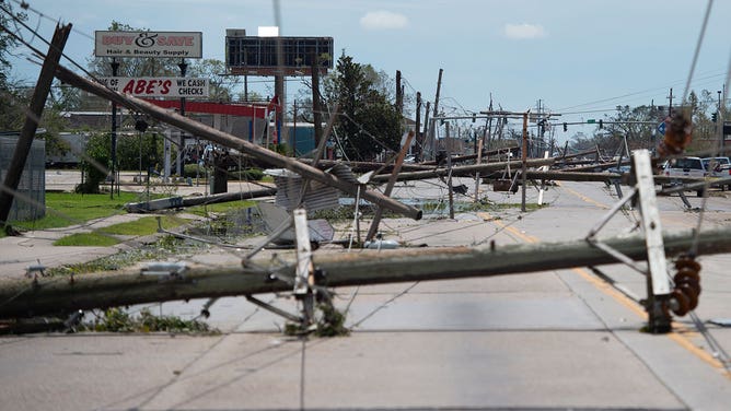 Downed power lines block a major road following the passing of hurricane Laura in Lake Charles, Louisiana, on Aug. 27, 2020.