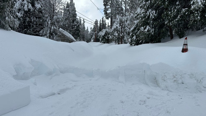 National Guard helps California residents dig out from several feet of snow