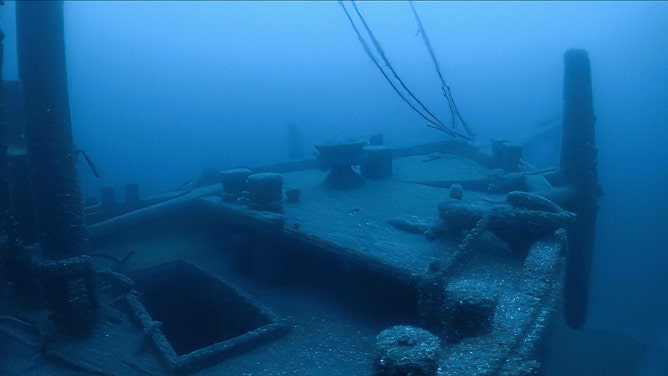 Ironton rests hundreds of feet below the surface with its three masts standing and rigging attached to the spars, and is magnificently preserved by the cold freshwater of Lake Huron. An anchor rests still attached on the bow of the sunken schooner barge.