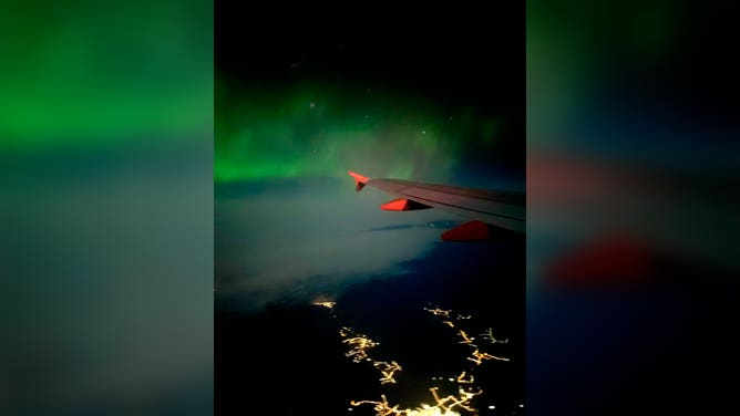 Northern Lights over the wing of easyJet flight from Reykjavik, Iceland to Manchester, U.K. February 27, 2023.