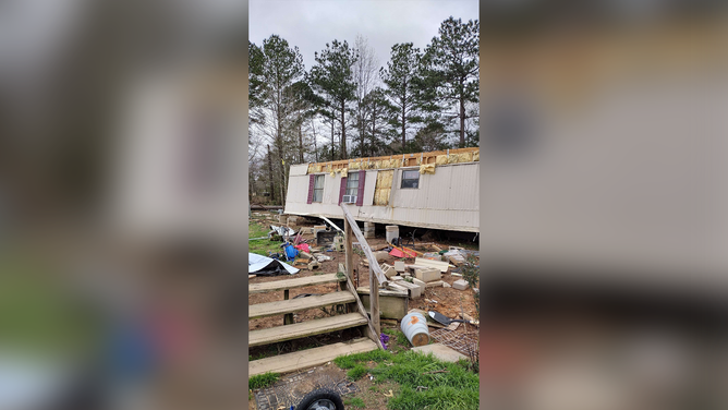 The Lawson family's mobile home was heavily damaged when an EF-2 tornado tore through Kirby, Arkansas, on March 2.