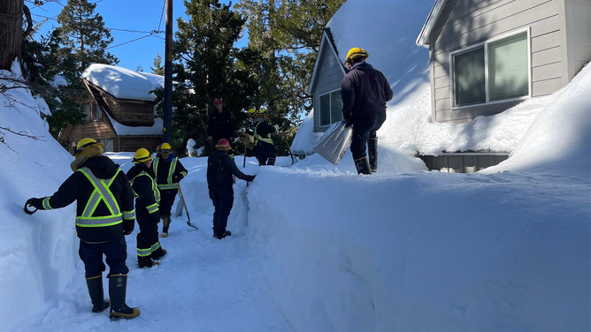 The California National Guard is going door-to-door to help residents dig out from several feet of snow with more on the way.