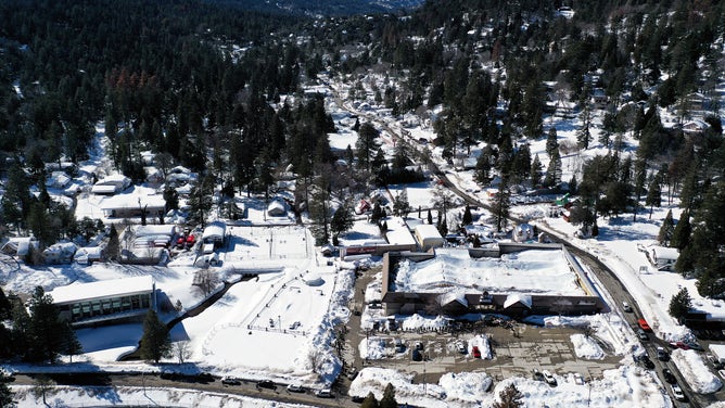 Desperate Crestline residents help one another while awaiting assistance from San Bernardino County