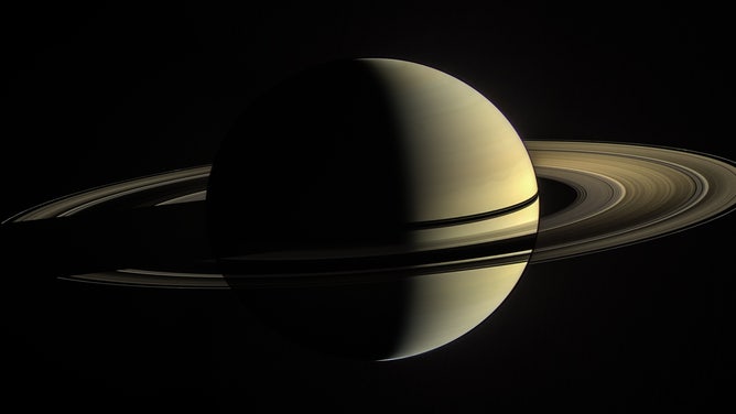 This was Cassini’s view from orbit around Saturn on Jan. 2, 2010. In this image, the rings on the night side of the planet have been brightened significantly to more clearly reveal their features. 