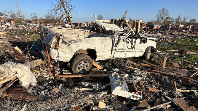 A destroyed truck is seen in a pile of debris after a deadly tornado in Rolling Fork, Mississippi, on Friday, March 24, 2023.