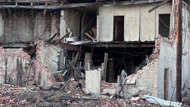 A wall was seen blown away from a building after a tornado in Rolling Fork, Mississippi, on Friday, March 24, 2023.