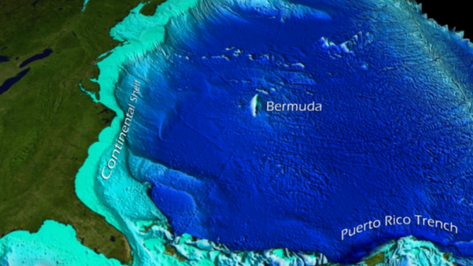 Graphic depicting satellite captured, bathymetric data of the western Atlantic Ocean Basin and its ocean floor features. The areas highlighted in light teal are part of the continental shelf of North America.