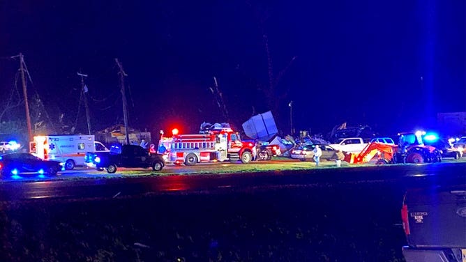 Emergency vehicle line a road in Silver City, Mississippi, after a tornado hit the town March 24, 2023.