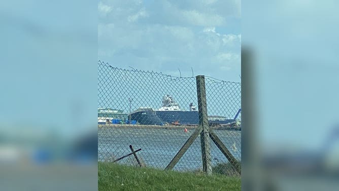 Large Research Vessel Tips Onto Scotland Dock
