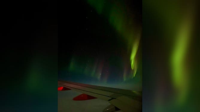 Northern Lights over the wing of easyJet flight from Reykjavik, Iceland to Manchester, U.K. February 27, 2023.