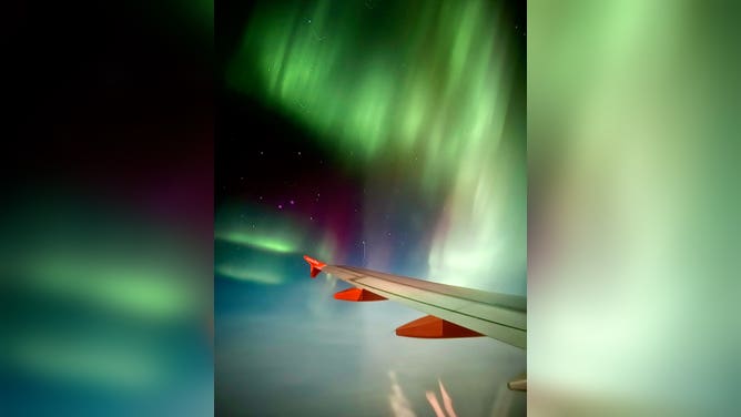 Northern Lights over the wing of easyJet flight from Reykjavik, Iceland to Manchester, U.K. February 27, 2023.