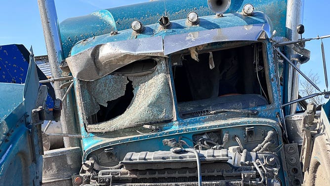 A tractor-trailer is seen mangled March 27, 2023, in Rolling Fork, Mississippi, after a tornado hit the rural town.