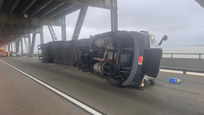 A truck topples on a San Francisco area bridge