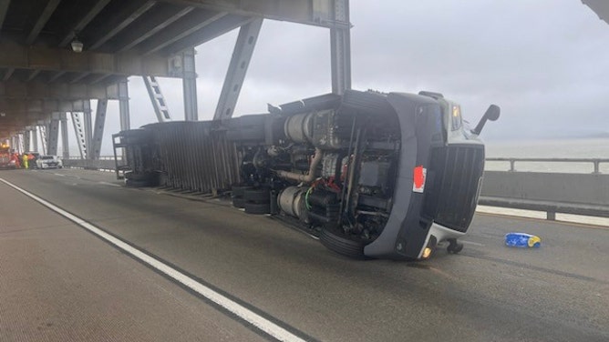 A truck topples on a San Francisco area bridge