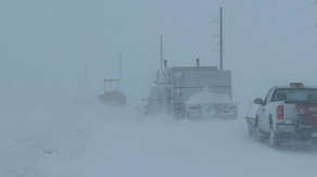 What makes a blizzard different from an ordinary snowstorm?
