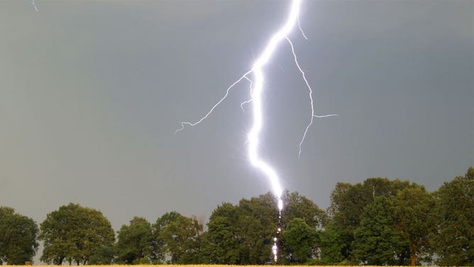 File image of a lightning strike in a rural area.
