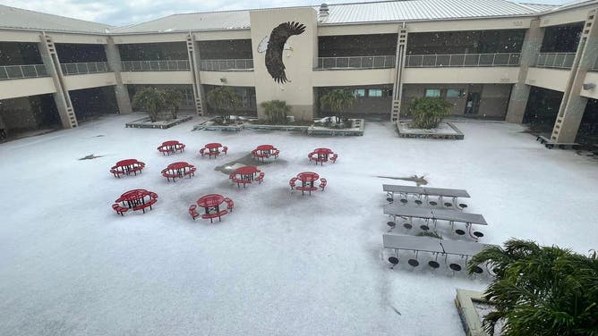 Hail covers a middle school's courtyard in Central Florida