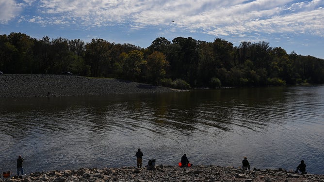 People fish along the Pearl River near the O.B. Curtis Water Treatment Plant on November 17, 2022 in Jackson, Mississippi.