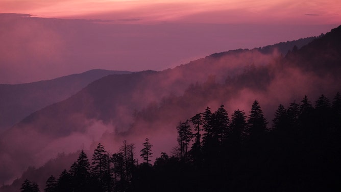 FILE - Fog settles near sunset in the Great Smoky Mountains National Park, TN, on July 23, 2016.