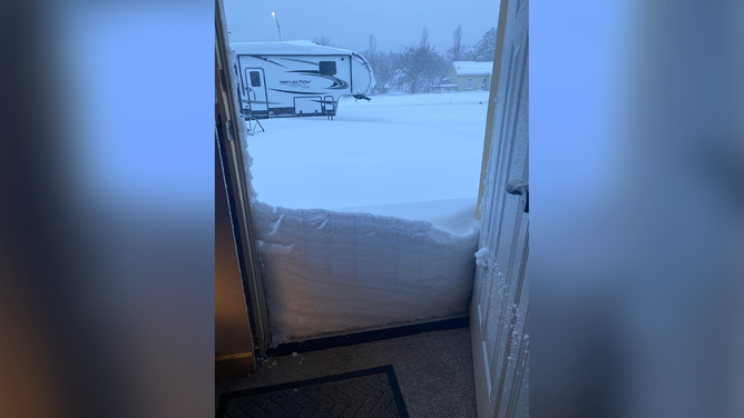 Several inches of snow is seen at a home in Merrillan, Wisconsin, on April 17, 2023.