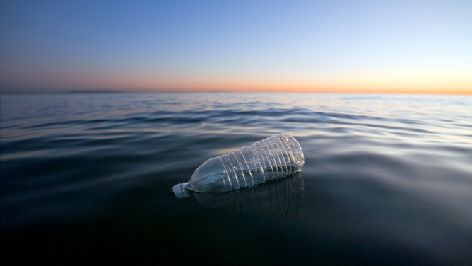 FILE - Plastic Water Bottle Floating in Pacific Ocean, Santa Monica, California.