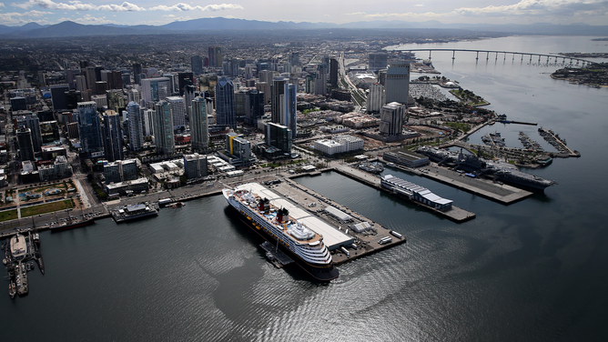 FILE - Aerial view of the Disney Wonder cruise ship docked at B Street Pier on March 20, 2020 in San Diego, California.