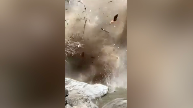 Debris flies through the air.