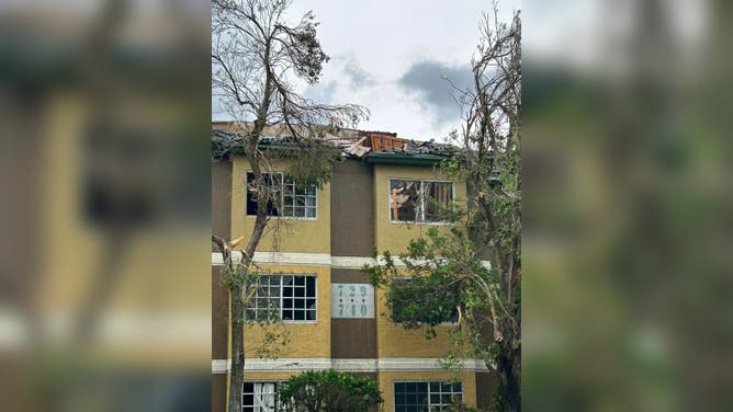 Apartment complex damage by suspected tornado.