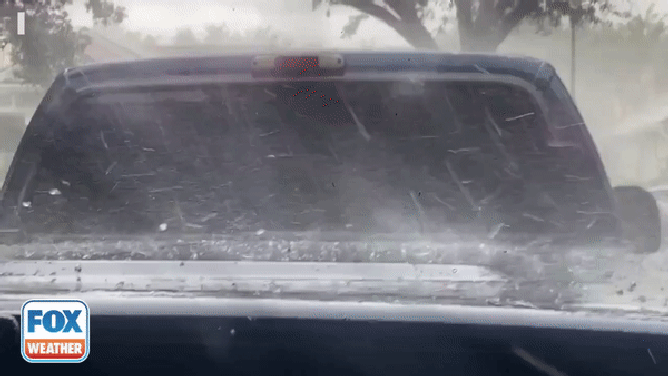 Hail is caught on video bouncing off a truck in Jupiter, Florida. 