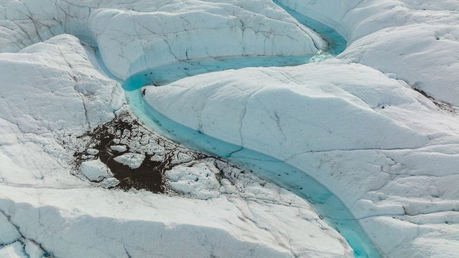 An aerial view of meltwater lakes formed at the Russell Glacier front, part of the Greenland ice sheet in Kangerlussuaq, Greenland, on August 16, 2022.
