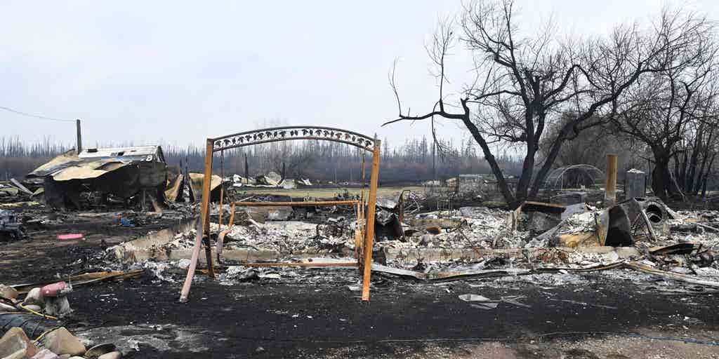 Dozens of Alberta wildfires force more than 24,000 to flee, send smoke ...